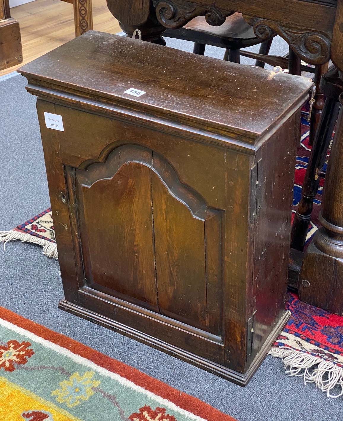 A late 17th century oak spice cupboard, enclosed by a fielded panelled door, width 48cm, depth 23cm, height 56cm